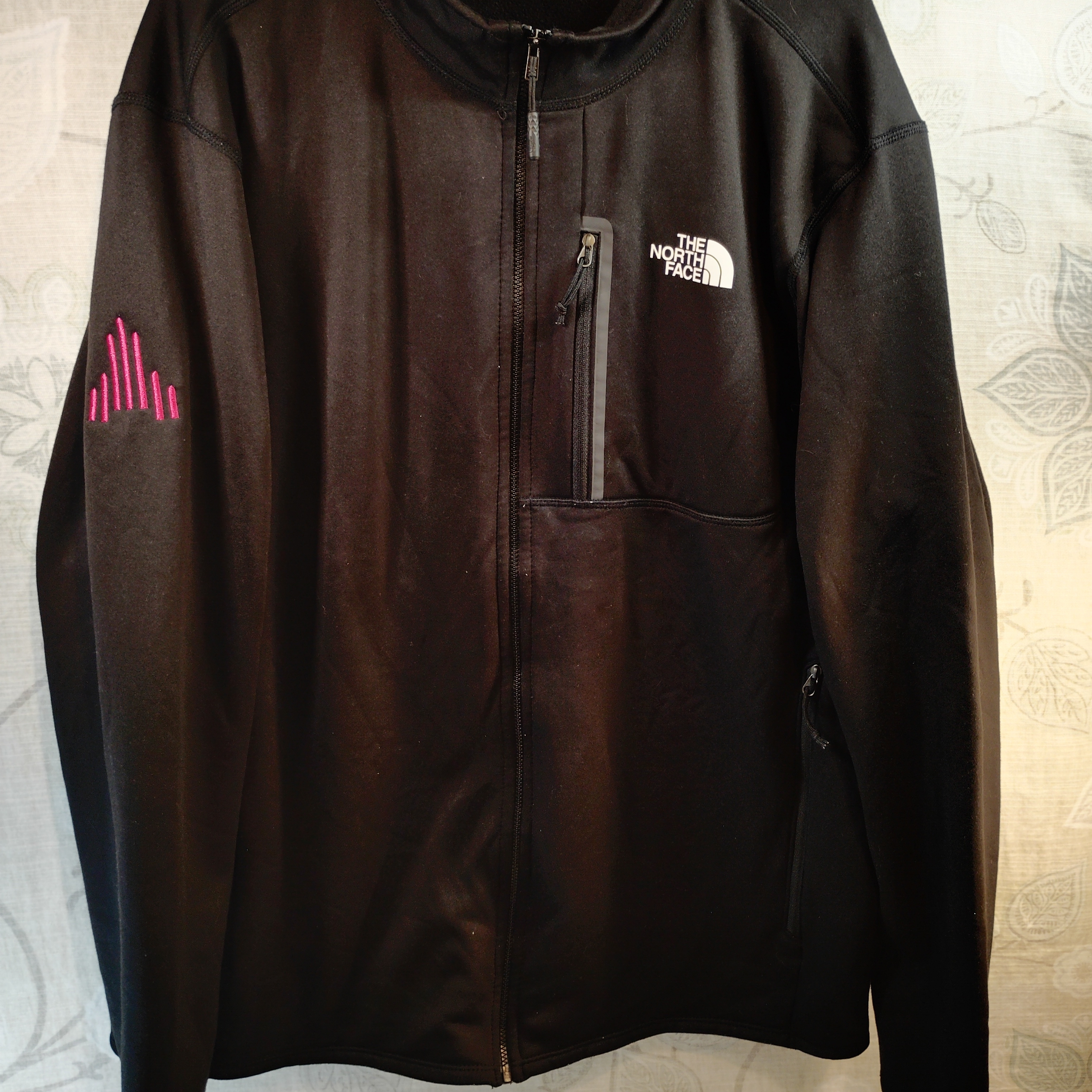 The North Face Black Performance Jacket With A Pink Accent Design Right Arm